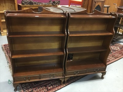 Lot 813 - Pair Georgian -style mahogany waterfall bookcases each with two drawers raised on cabriole legs.