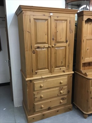 Lot 826 - Pine hanging cupboard on chest with two panelled doors and three drawers below