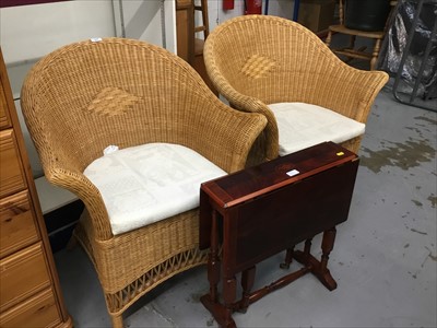 Lot 829 - Two conservatory chairs and Sutherland table