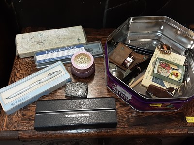 Lot 546 - Box containing pens, vesta case, lighter, and...