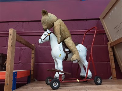 Lot 550 - Triang ride-on horse, teddy bear.