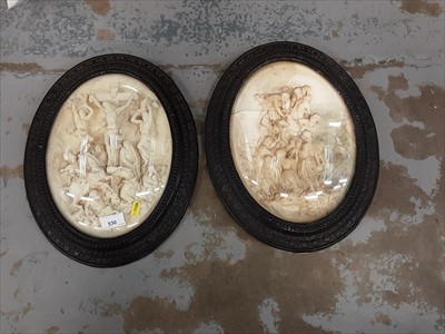 Lot 530 - Pair of plaster religious plaques