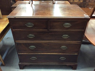 Lot 819 - Georgian mahogany chest of two short and three long graduated drawers on bracket feet.