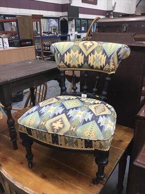 Lot 822 - Late Victorian ebonised nursing chair with geometric pattern  upholstery