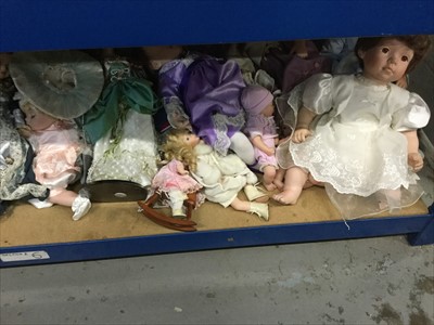 Lot 103 - Dolls- one shelf containing a large quantity of assorted dolls
