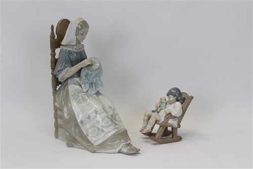 Lot 2052 - Two Lladro porcelain figures - seated lady in...