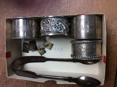 Lot 664 - Four silver napkin rings, silver sugar tongs and pair silver cufflinks