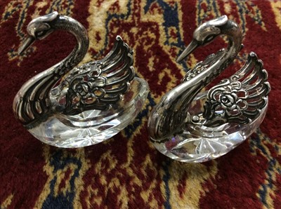 Lot 673 - Pair of glass swan ornaments with silver wings (2)