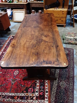 Lot 930 - Rustic refectory table on end standards joined by stretcher