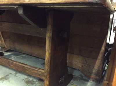 Lot 930 - Rustic refectory table on end standards joined by stretcher