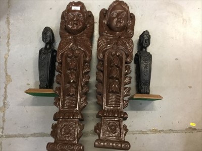 Lot 217 - Pair of large Victorian carved wooden corbels, together with a smaller pair on wooden plinths