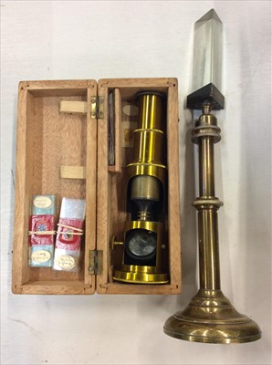 Lot 454 - Brass microscope with slides and Victorian brass prism