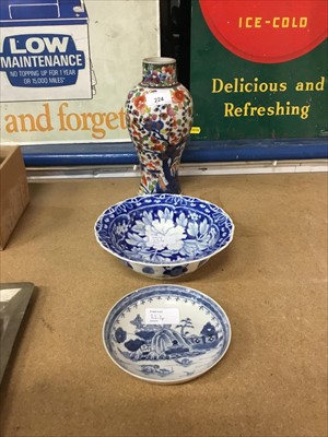Lot 224 - 18th/19th century Chinese clobbered vase, blue and white saucer, and later Japanese bowl (3)