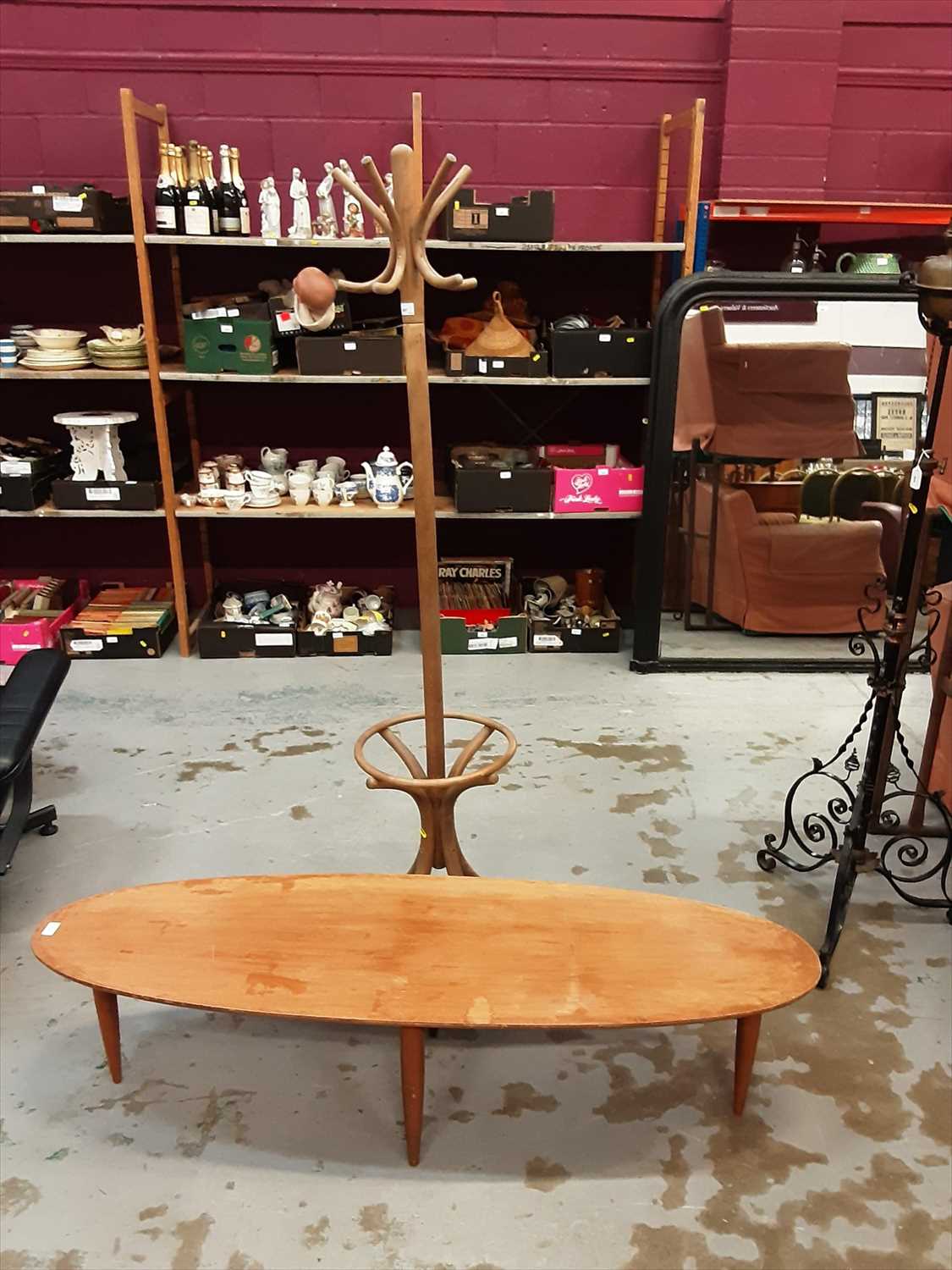 Lot 947 - Bentwood coat and hat stand plus a teak oval coffee table (2)