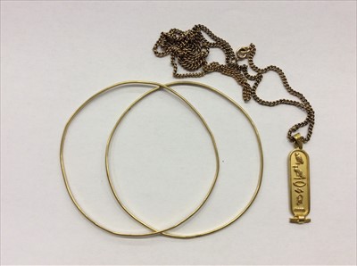 Lot 684 - Egyptian gold pendant on chain and two Continental gold (585) bangles