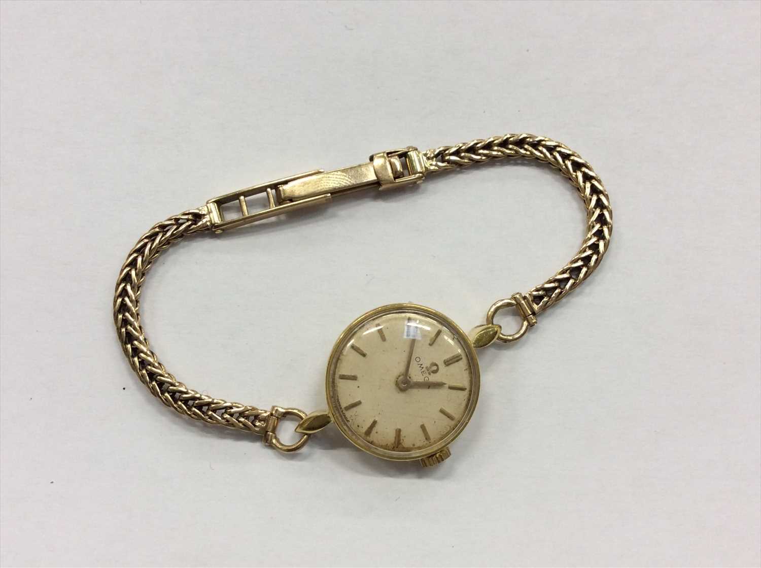 Lot 685 - Omega gold case wristwatch on gold 9ct bracelet