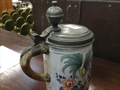 Lot 311 - Antique Delft tankard with polychrome Chinese figure and floral decoration with pewter hinged cover ( replacement handle)