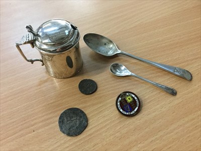 Lot 701 - Silver mustard pot, two silver spoons and group of coins including an enamelled coin brooch