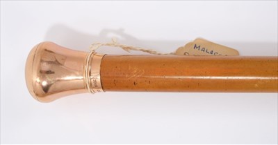 Lot 687 - Edwardian 12ct gold mounted malacca cane by Brigg, the roundel import marks for London 1903, stamped BRIGG, engraved with initials