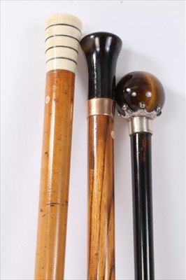 Lot 689 - Victorian malacca and ivory cane, the tapering roundel with silver bands, tapering shaft and ivory ferrule, 91cm long, together with Victorian ebonised case with tiger's eye terminal and 19th centu...