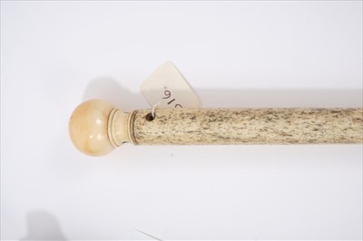 Lot 695 - Late 18th / early 19th century narwhal and ivory walking stick, with spherical carved ivory handle on tapering shaft, 83cm long