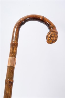 Lot 709 - Early 20th century 12ct gold mounted bamboo walking stick, the crook handle with root terminal, the 12ct gold collar with import marks for London 1920, and stamped BRIGG, LONDON, initials A.R.M.R.,...