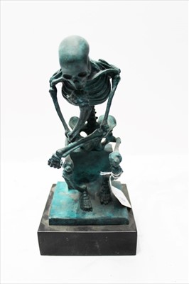 Lot 1854 - Bronze study of a seated skeleton in the 'Thinker' pose, with green patination, signed - 'Milo', on slate socle, 28cm high