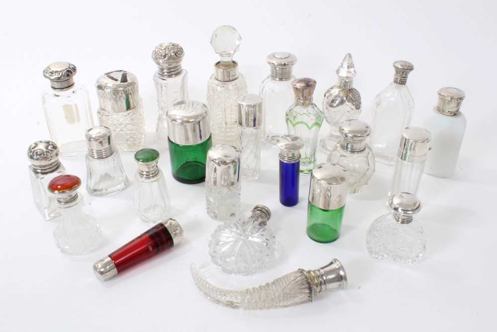 Lot 221 - Collection silver topped glass scent bottles and a silver vanity cased set