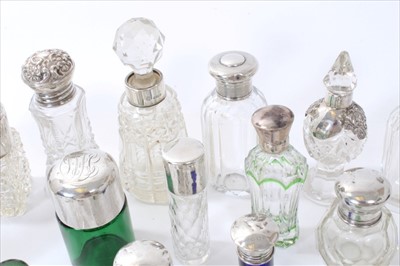 Lot 221 - Collection silver topped glass scent bottles and a silver vanity cased set