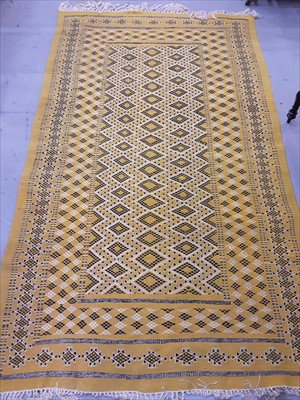 Lot 859 - Eastern rug with geometric decoration on yellow ground 262cm x 162cm