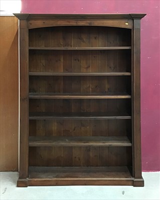 Lot 885 - Pair of Antique Style stained pine open bookcases