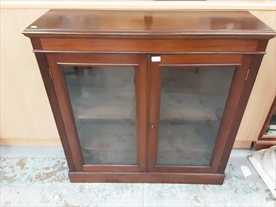 Lot 884 - Victorian walnut bookcase with shelved interior enclosed by two glazed doors