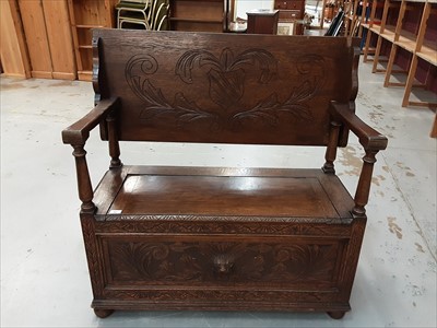 Lot 881 - Carved oak monks bench with lion mask decoration