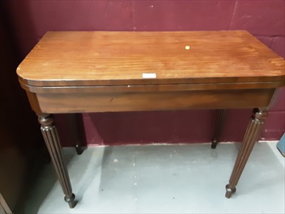 Lot 872 - Victorian mahogany card table with fold over leather lined top on reeded legs