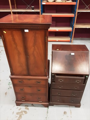 Lot 901 - Reproduction bureau of narrow proportions together with a reproduction drinks cabinet