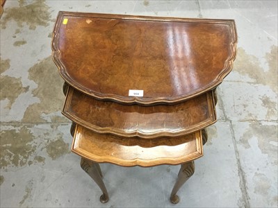 Lot 904 - Nest of three walnut veneered occasional tables