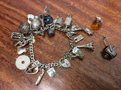 Lot 650 - Silver charm bracelet with quantity novelty charms