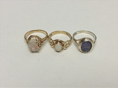 Lot 654 - Three opal rings