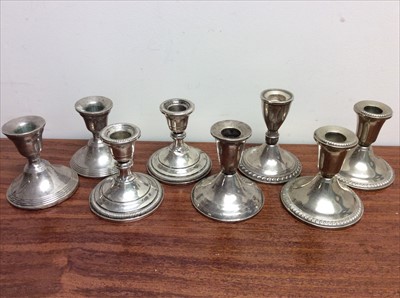 Lot 662 - Eight dwarf candlesticks (six marked ‘Sterling weighted’ to base)