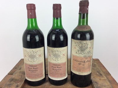 Lot 75 - Group of nine wines to include: Chateau Talbot, Caron Segur 1959 and others, contained in a wooden crate