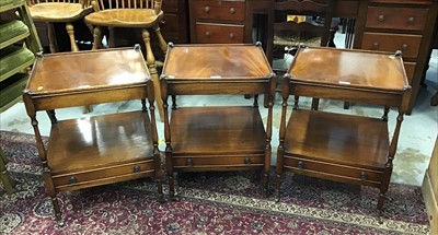 Lot 949 - Set of three mahogany two tier bedside tables