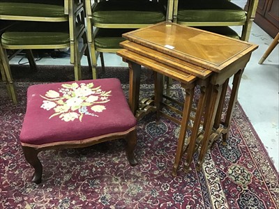 Lot 957 - Nest of three walnut tables together with an embroidered stool