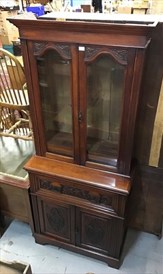 Lot 916 - Victorian walnut secretaries bookcase with glazed doors above enclosing adjustable shelves, ornately carved drawer and panelled doors below on plinth base