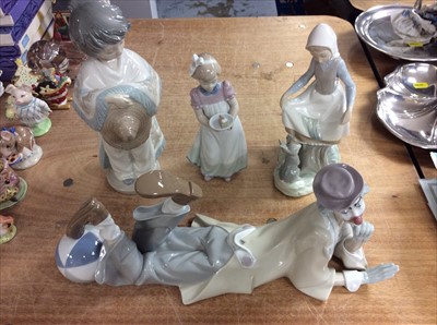 Lot 405 - Lladro Clown figure, together with two other Lladro figures and a NAO figure (4)
