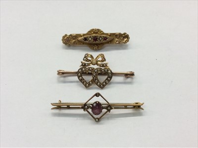 Lot 666 - Victorian gold 9ct bar brooch, seed pearl heart brooch and one other gold 9ct bar brooch (3)