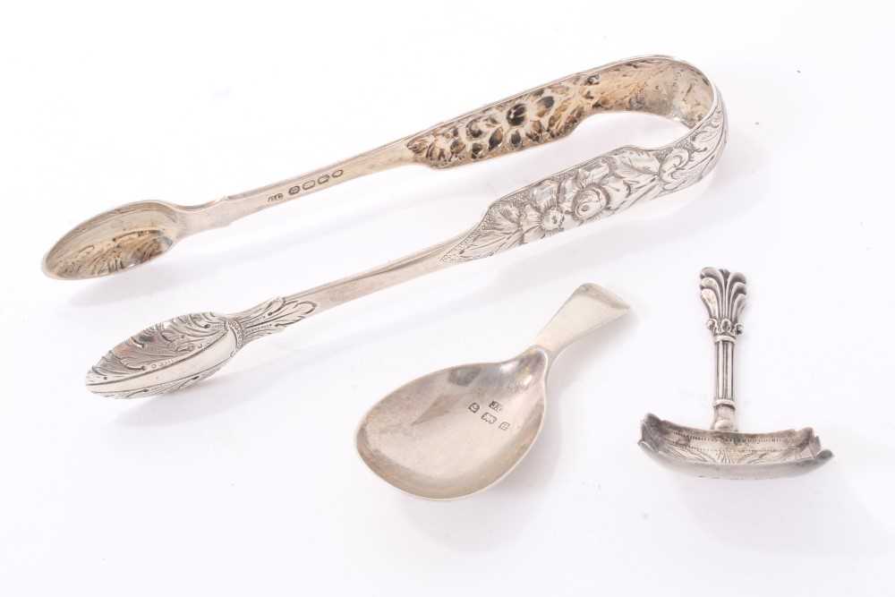 Lot 228 - Pair of Georgian Irish silver sugar tongs and two silver caddy spoons