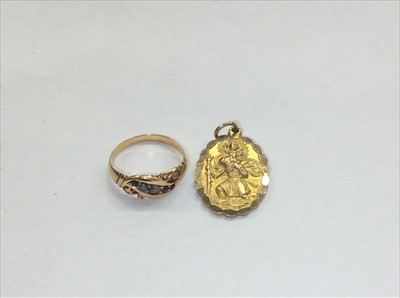 Lot 683 - Gold 9ct St. Christopher pendant and yellow metal blue stone ring