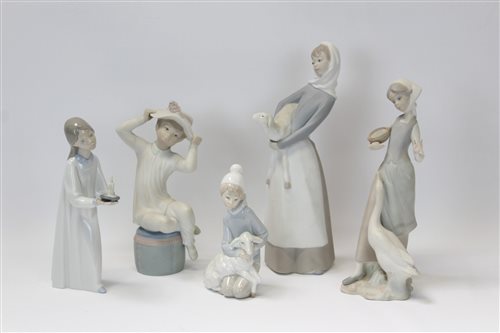 Lot 2142 - Five Lladro porcelain figures - girl with lamb,...