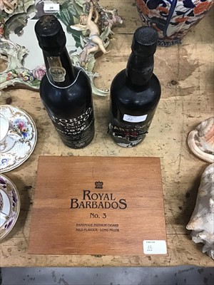 Lot 22 - Port - two bottles, Porto Santos 1970 and Martinez, label torn, together with a collection of eleven Royal Barbados cigars in box