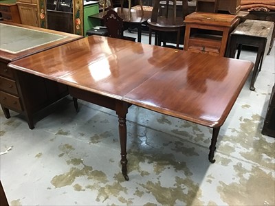 Lot 980 - Victorian mahogany drop leaf table on turned legs and brass castors